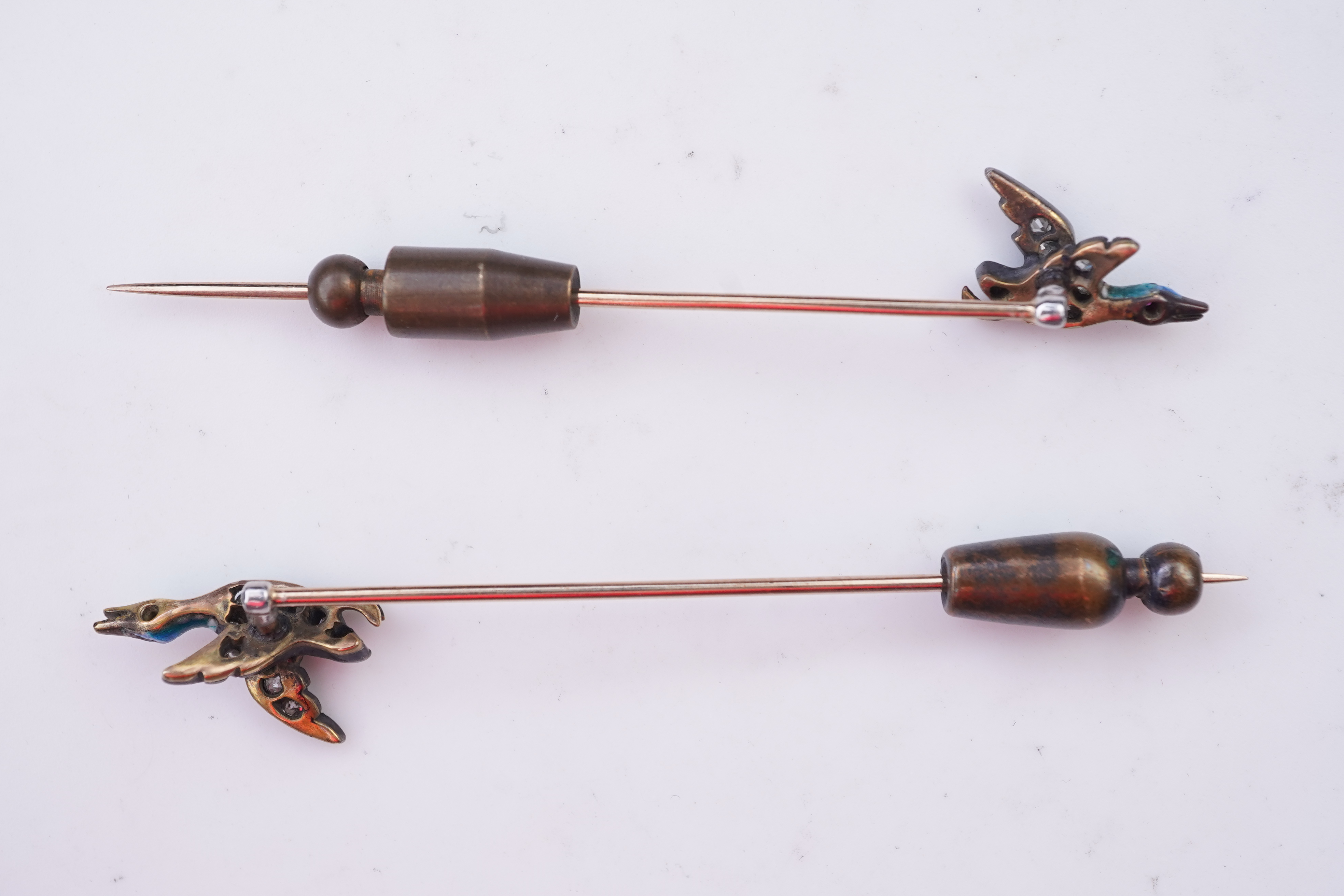 A pair of novelty enamel and diamond stick pins, circa 1900